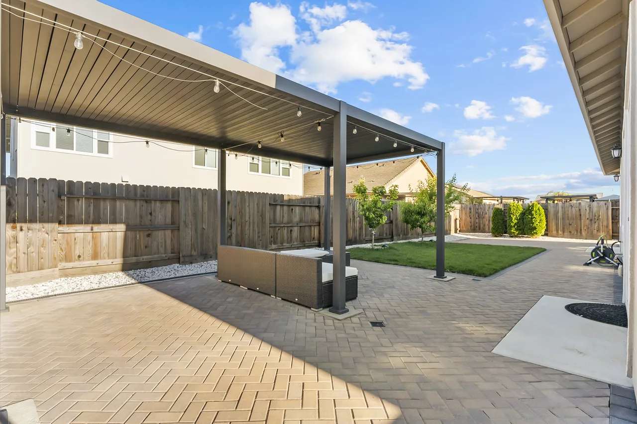 Backyard pergola with paver patio