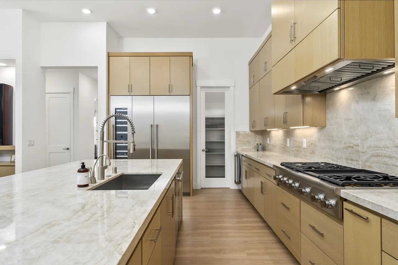 Modern kitchen with island and stainless appliances