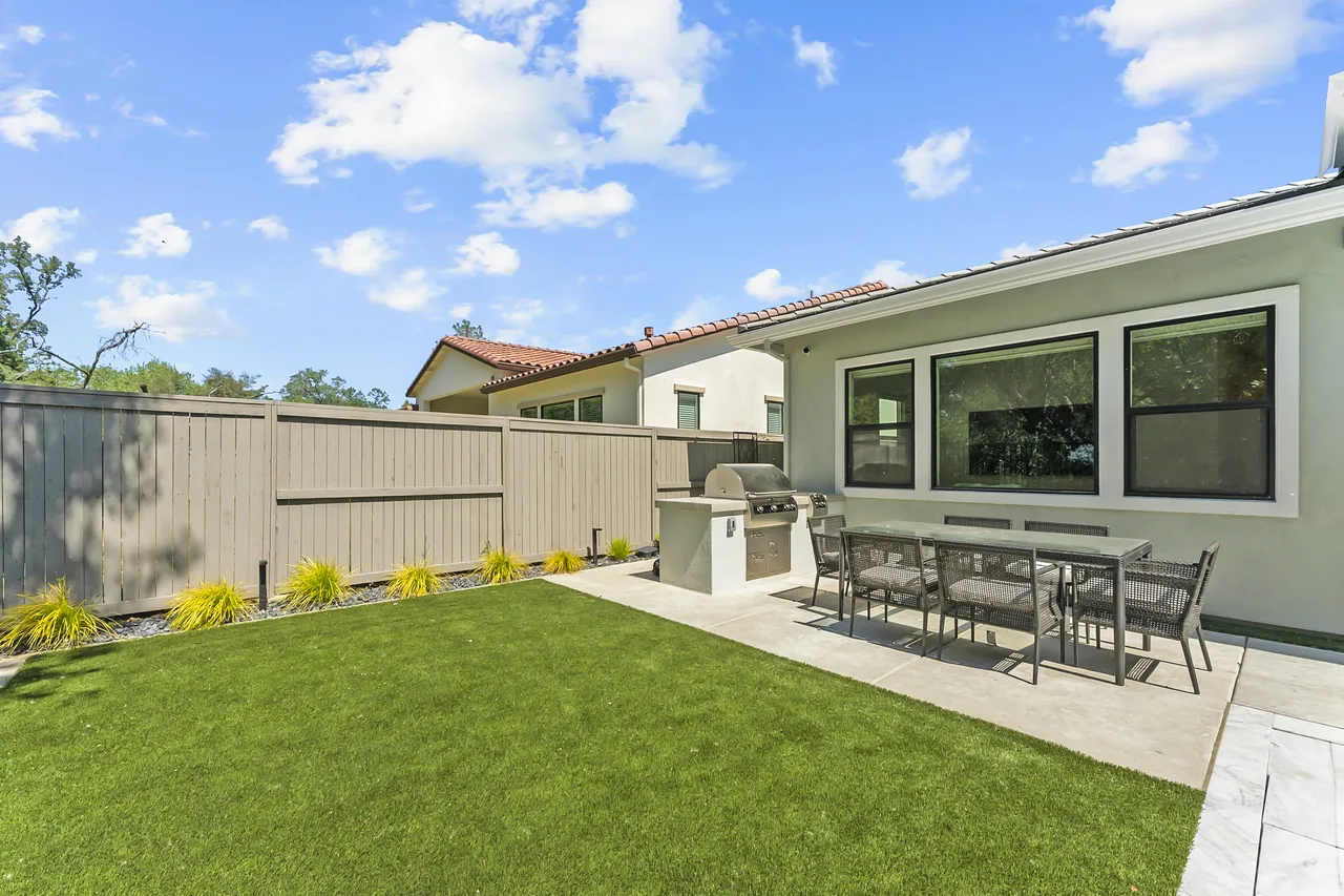 Outdoor living area with grill and dining