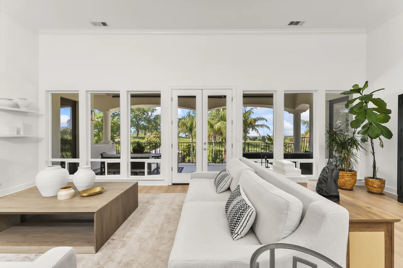 Open living room with French doors to terrace