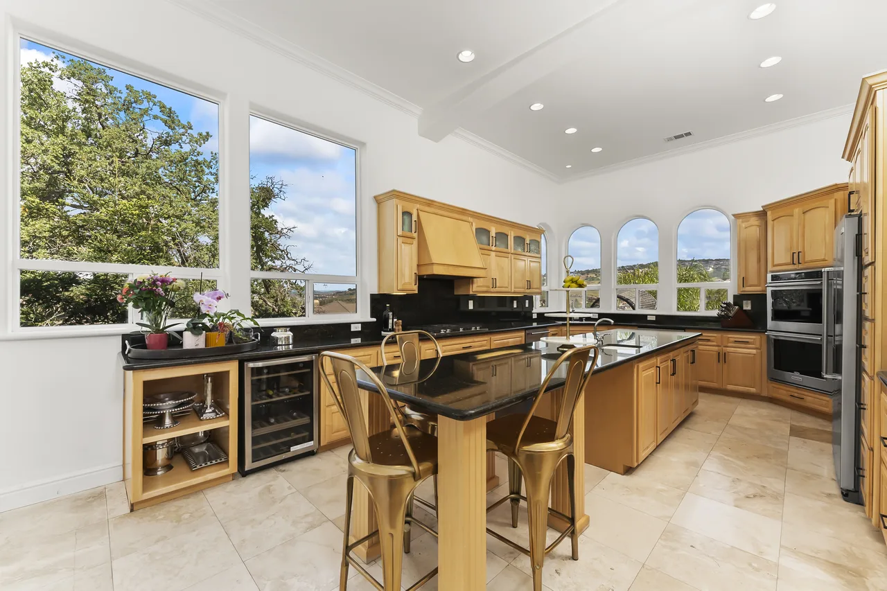Kitchen with arched windows and chandelier