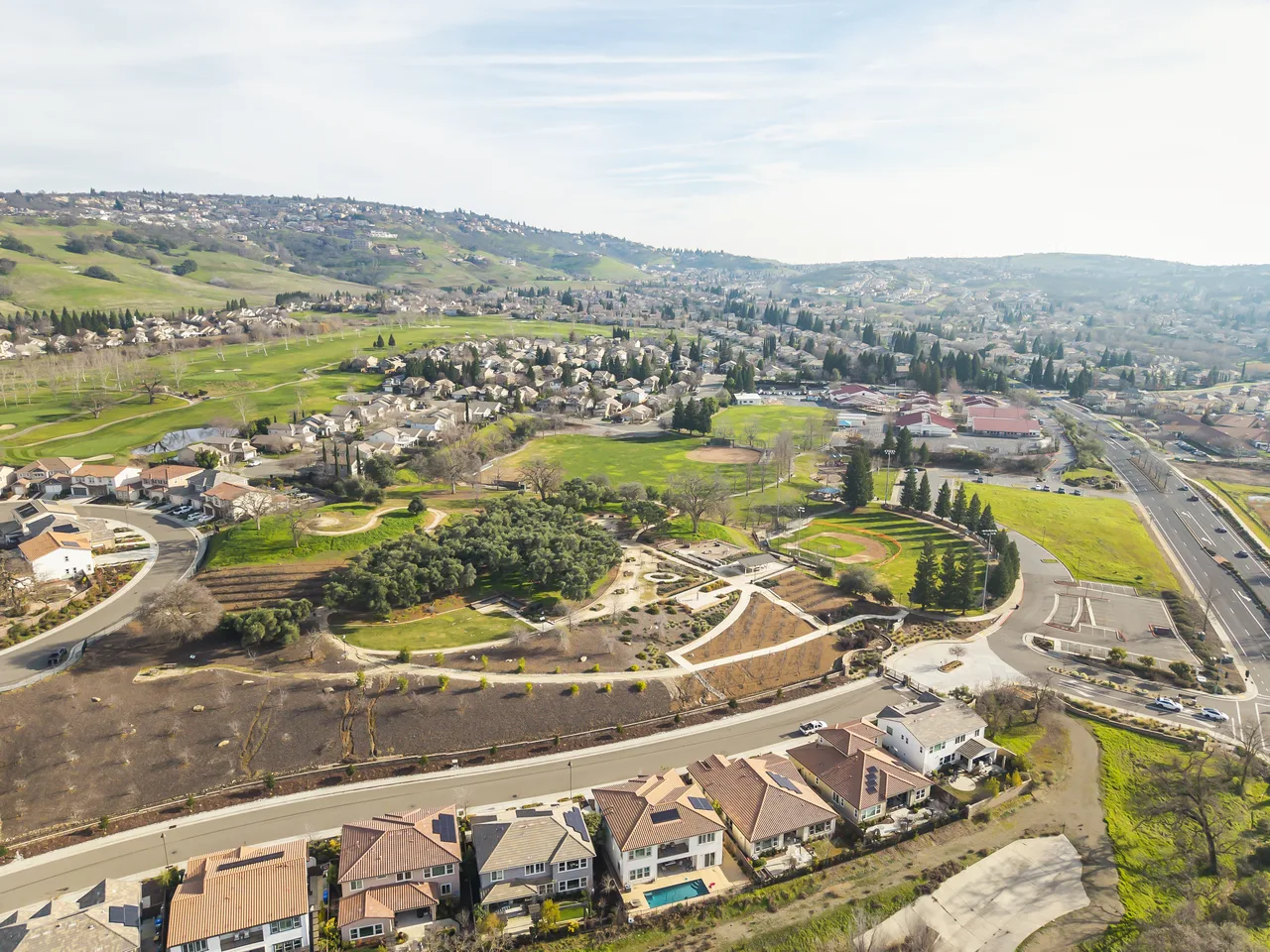 Aerial of Folsom community with rolling hills